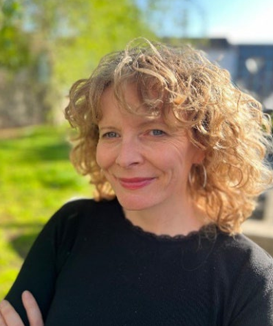 A photo of Dr. Vickie Cooper, the author of the report in a outdoor rural green background