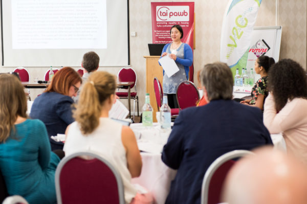 Noreen Blanluet presenting with delegates in the foreground