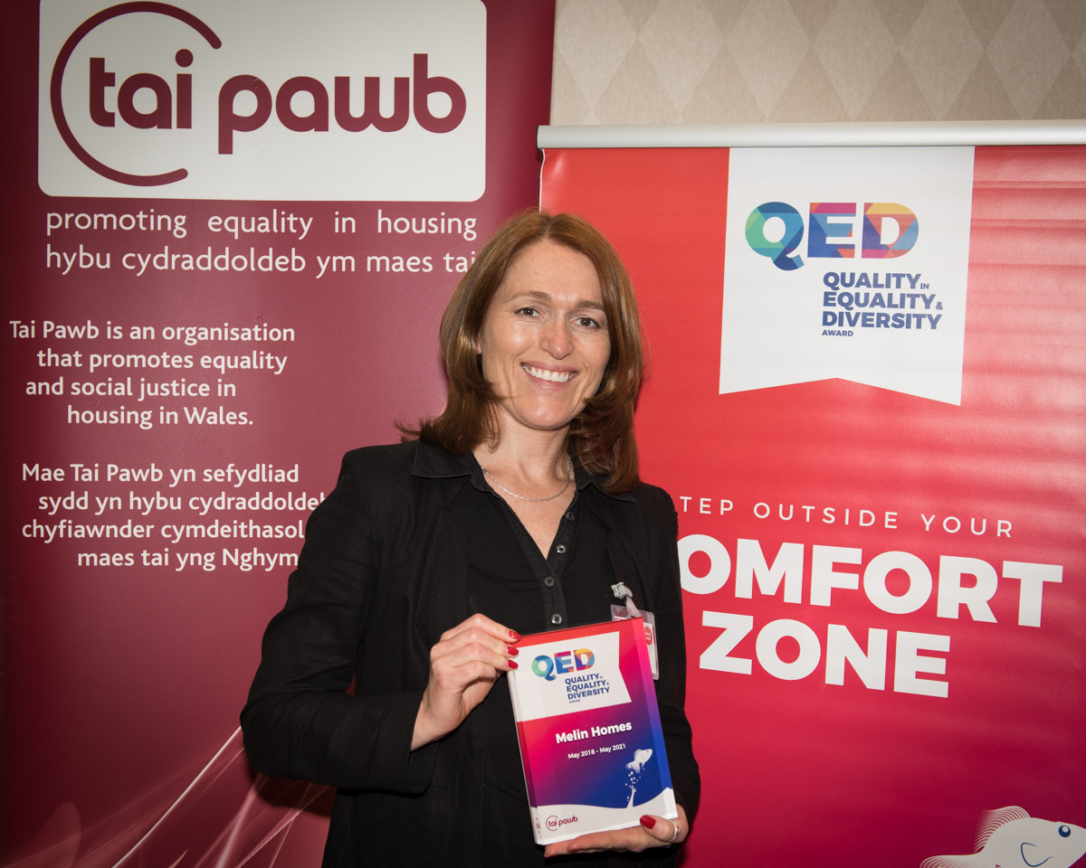 Paula Kennedy from Melin Homes holds a QED Award