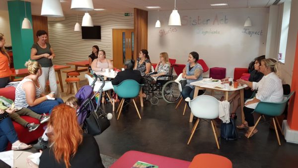 A group of women sitting informally and talking