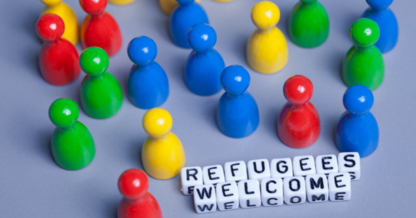 Pins representing people and the text saying refugees welcome