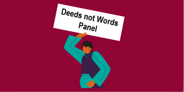 a person holding a banner saying deeds not words panel