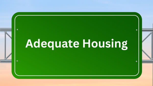 motorway road sign with Adequate Housing written on it